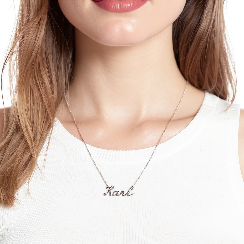 Close-up of sterling silver texture on personalized name necklace, macro texture shot
